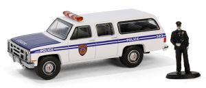 GREEN97160-D - GMC Suburban 2500 1985 Police avec figurine de la série THE HOBBY SHOP sous blister